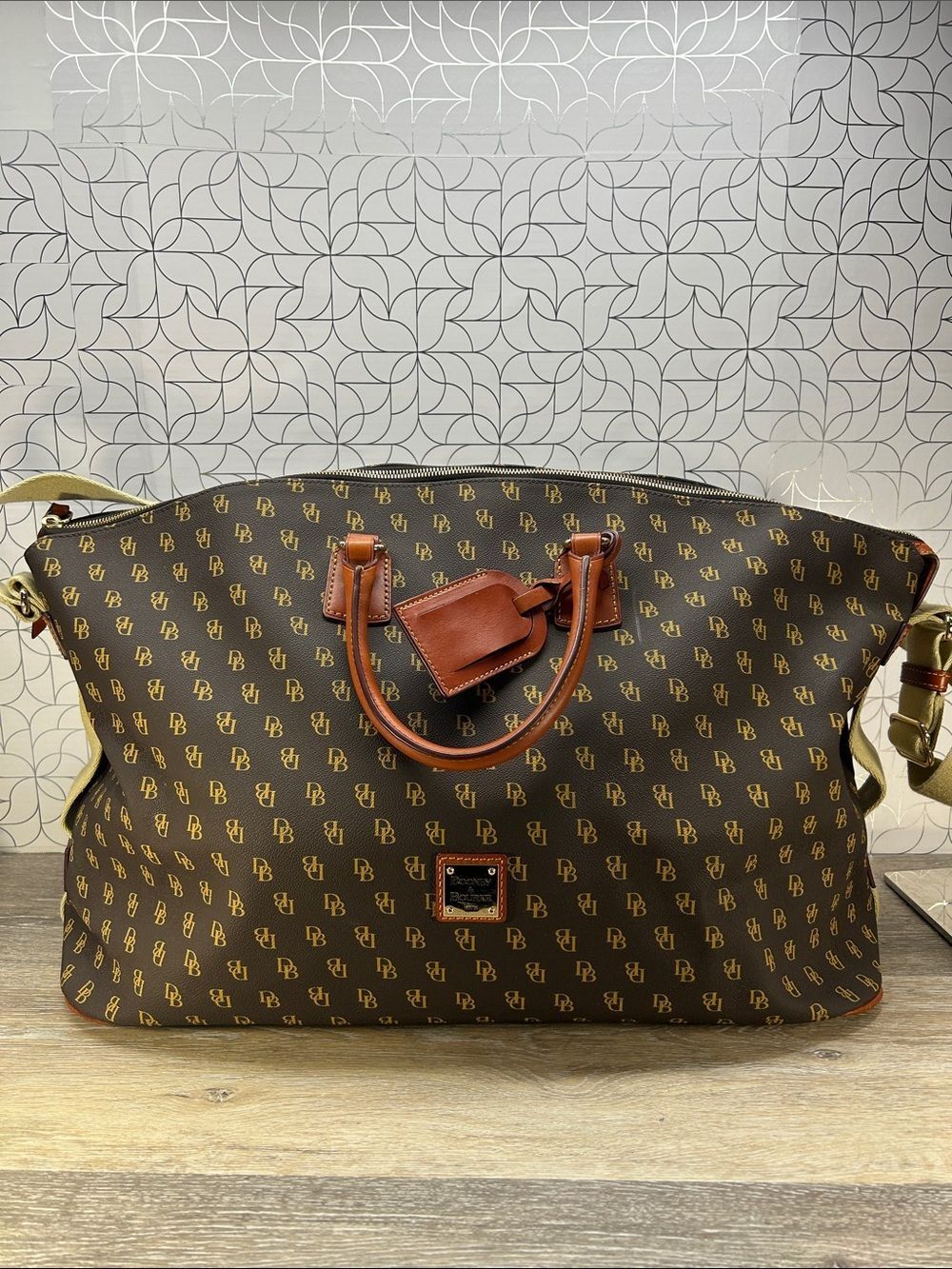 Dooney & Bourke Brown Logo Duffel with Tan Leather Accents